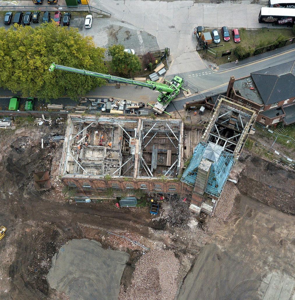 Aerial view of two buildings stripped out showing structural propping.