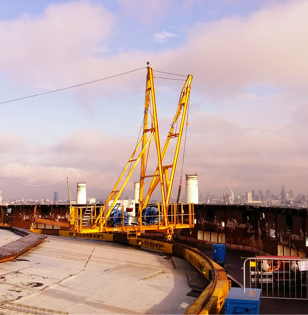 Gas holder crane positioned on top of gas holder.