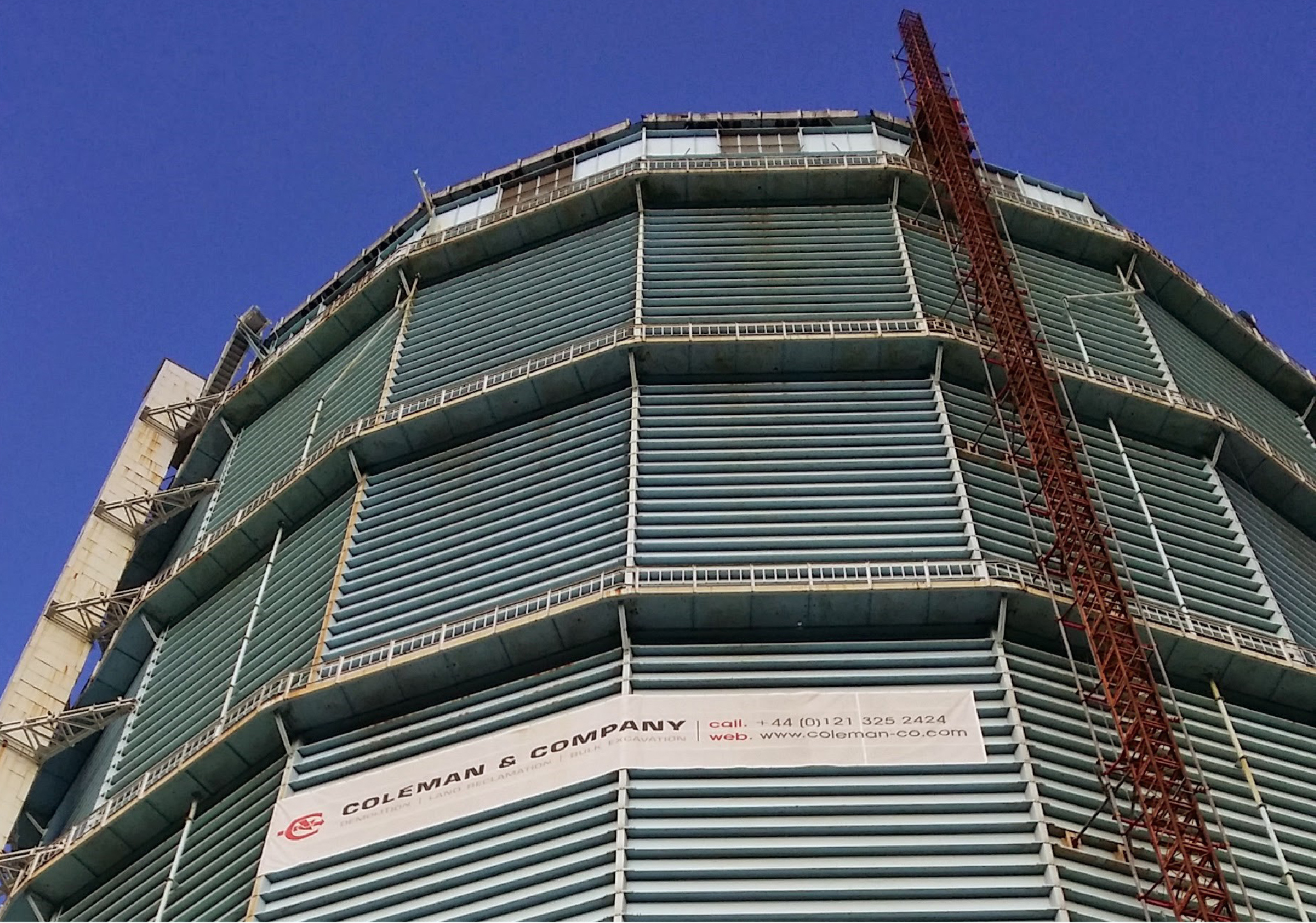 Battersea Gas holder with Colemans branded banner on the front of it.