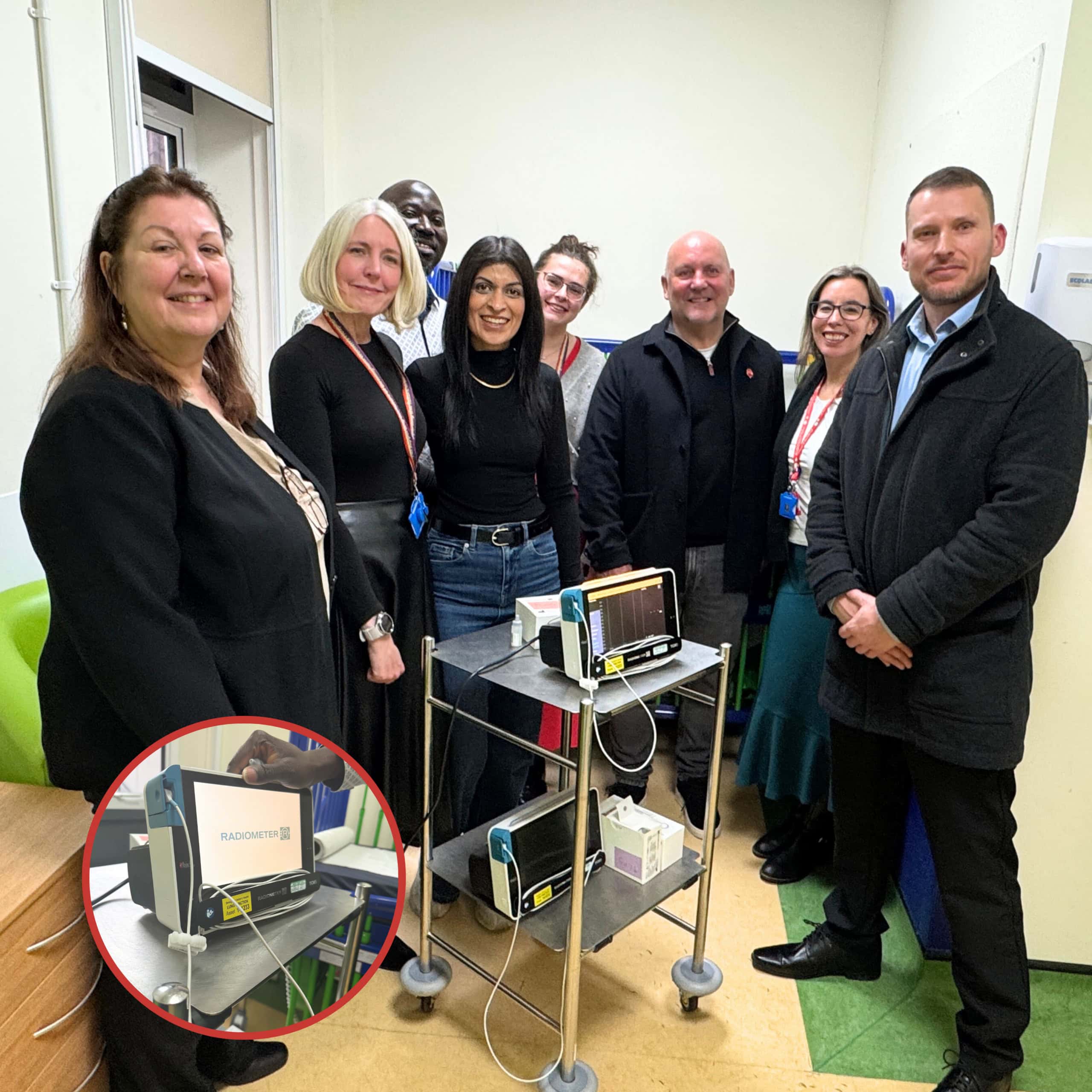 Colemans representatives visiting Birmingham Children’s Hospital, standing beside two transcutaneous carbon dioxide monitoring devices funded through the Changemaker programme.